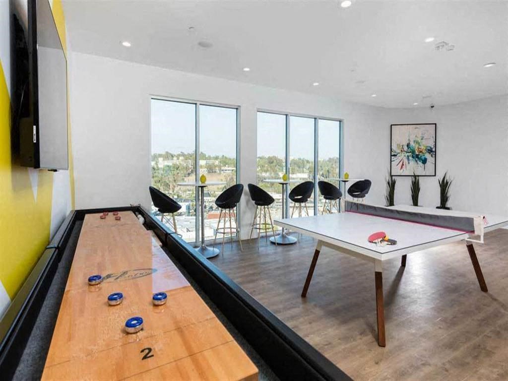 a game room with a ping pong table and a view