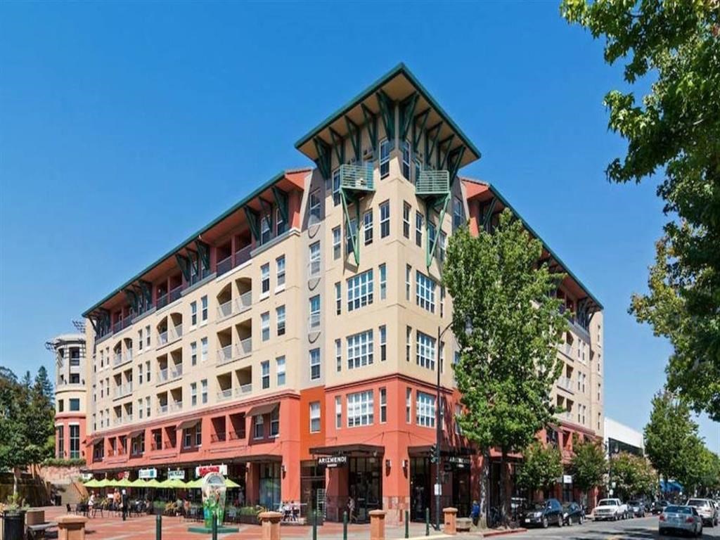 a building with a triangular roof on top of it