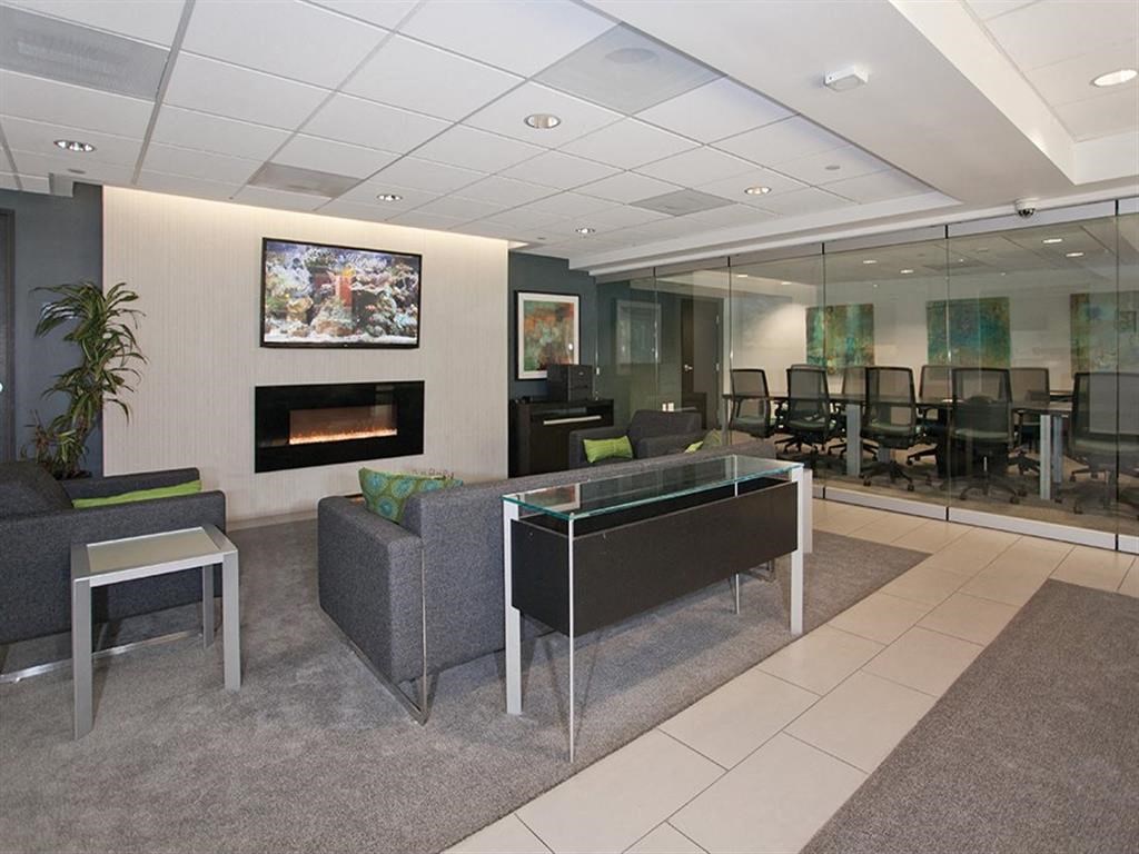 a room with a table and chairs and a fireplace