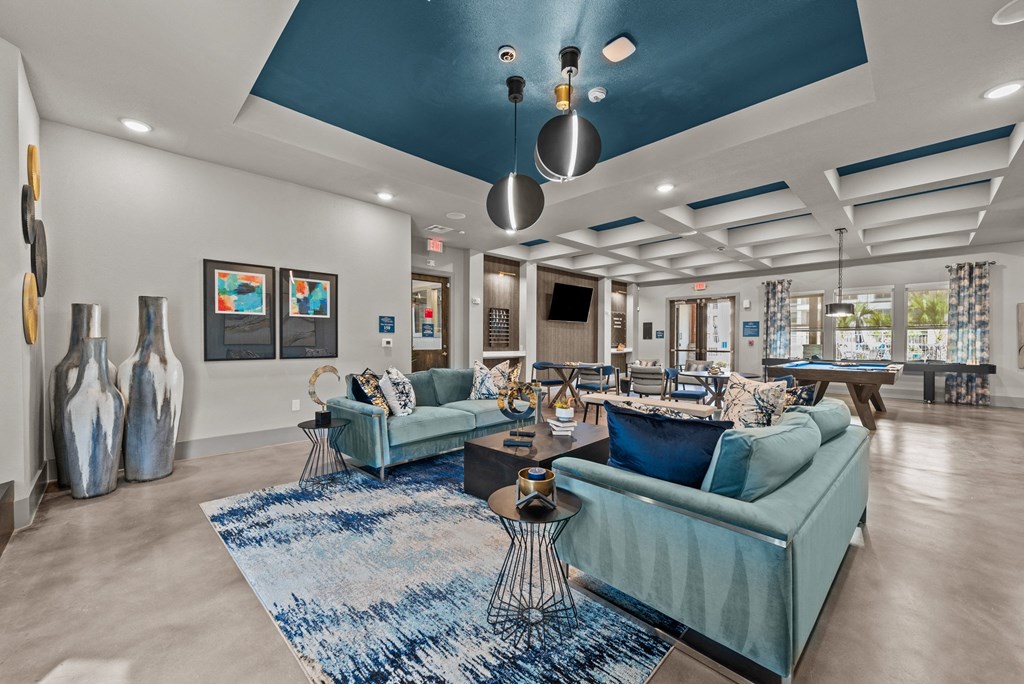 the preserve at ballantyne commons clubhouse with blue couches and chairs