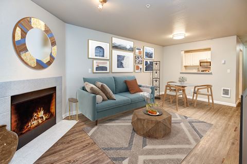 a living room with a fireplace and a blue couch