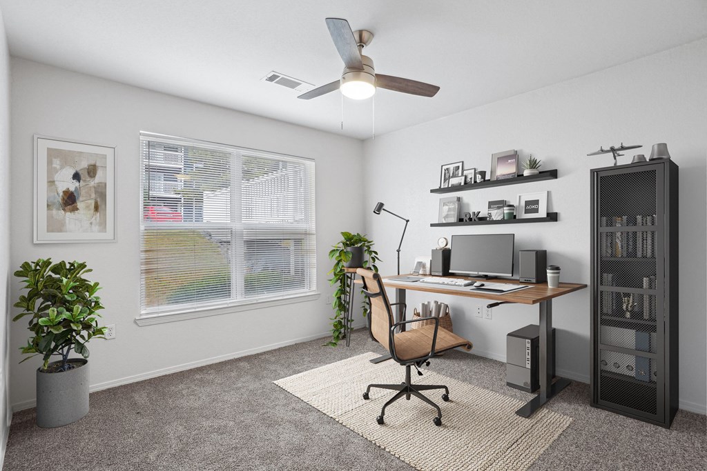 2 & 3-Bedroom Apartments for Rent in Little Rock, AR – Capitol Hill – A room with a desk, chair, and a ceiling fan.