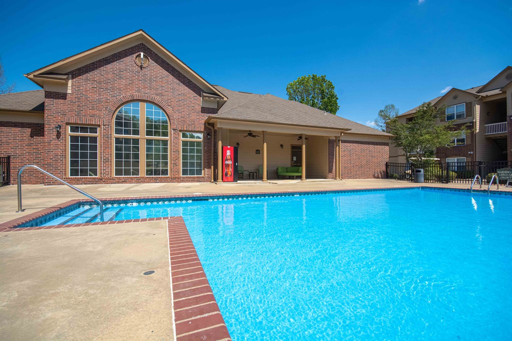 Swimming pool with the clubhouse in the back