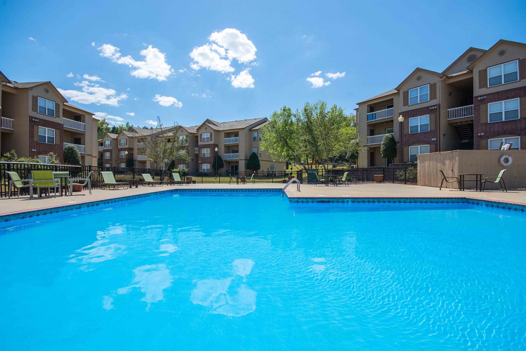 2 & 3-Bedroom Apartments for Rent in Little Rock, AR – Capitol Hill – Swimming pool with the apartment complex in the background