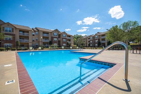 Pet-Friendly Rentals in Little Rock, AR – Capitol Hill – Swimming pool with the apartment complex in the background
