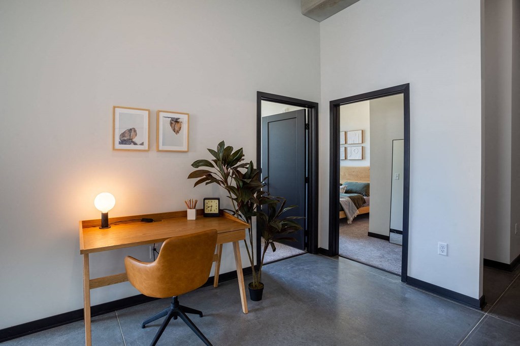 a home office with a desk and chair