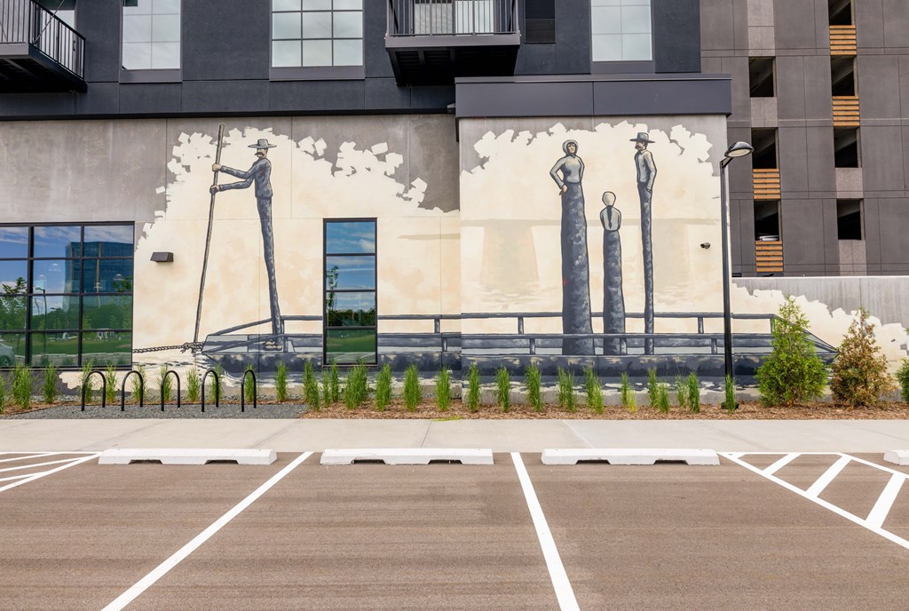 a mural of three women on the side of a building