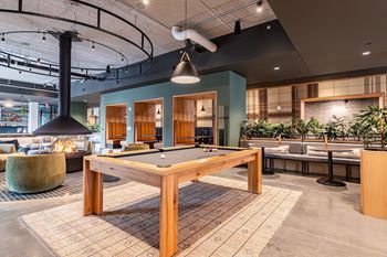 a pool table in a lobby of a building