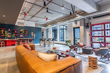 the interior of a living room with a couch and chairs