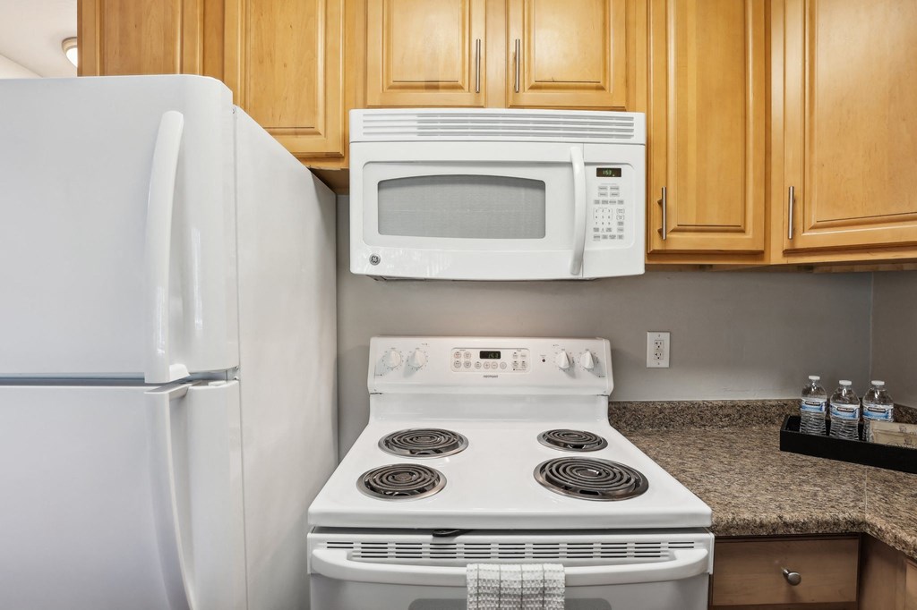 a kitchen with a stove microwave and refrigerator