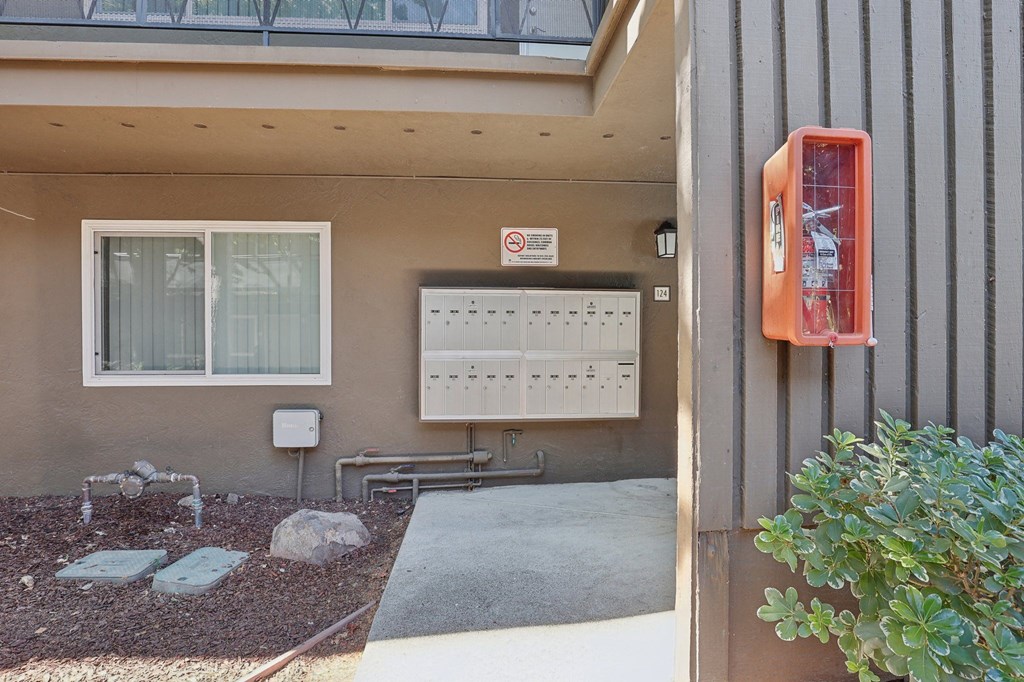 the outside of a building with a mailbox and a mail box and a door with