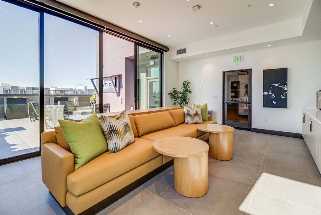 a living room with a couch and two tables