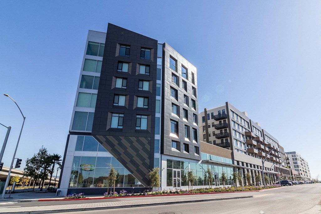 a modern building with a geometric facade on a city street