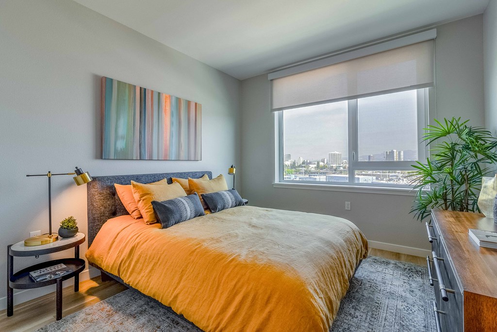 a bedroom with a large bed and a window