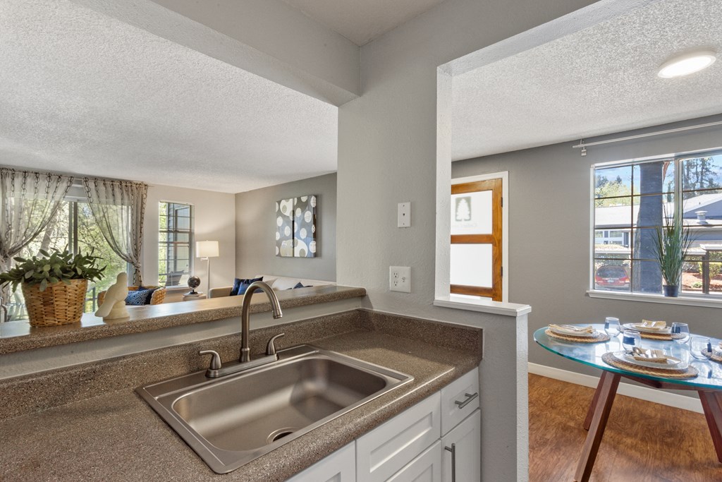 A kitchen with a sink and a window. at Cedar Crest, Beaverton
