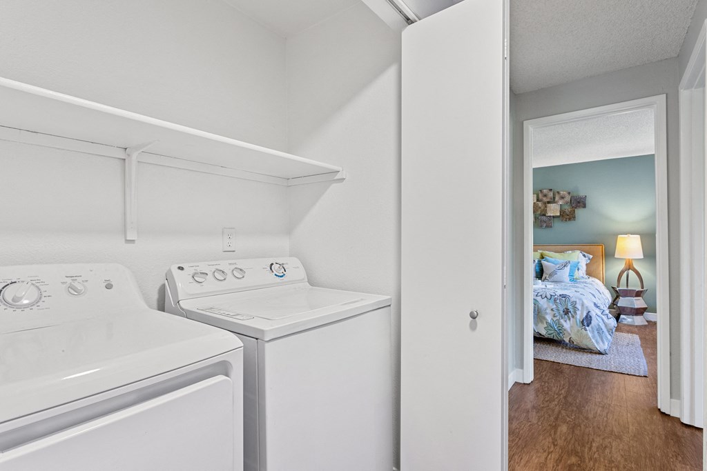A small laundry room with a washer and dryer. at Cedar Crest, Beaverton, Oregon