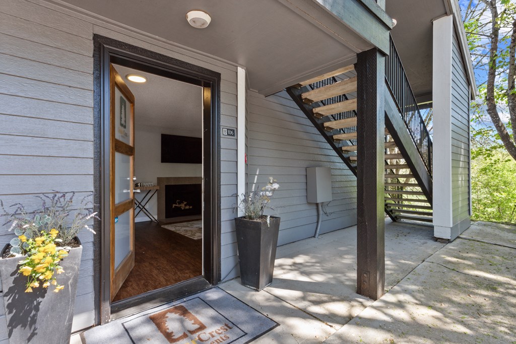A white house with a wooden door and a staircase. at Cedar Crest, Beaverton, 97078