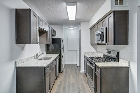 Chelsea Apartments in Gainesville Florida photo of kitchen with stainless steel appliances