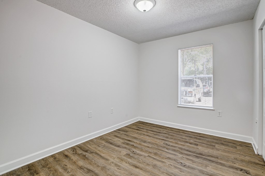Chelsea Apartments in Gainesville Florida photo of bedroom with hardwood flooring