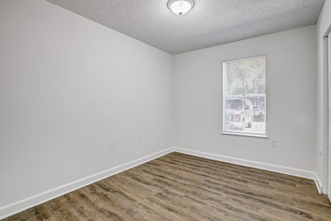 Chelsea Apartments in Gainesville Florida photo of bedroom with hardwood flooring