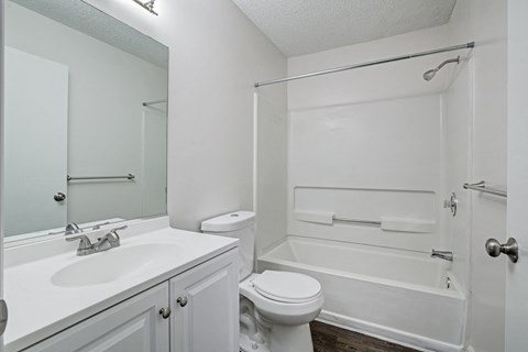 Chelsea Apartments in Gainesville Florida photo of bathroom with white cabintry
