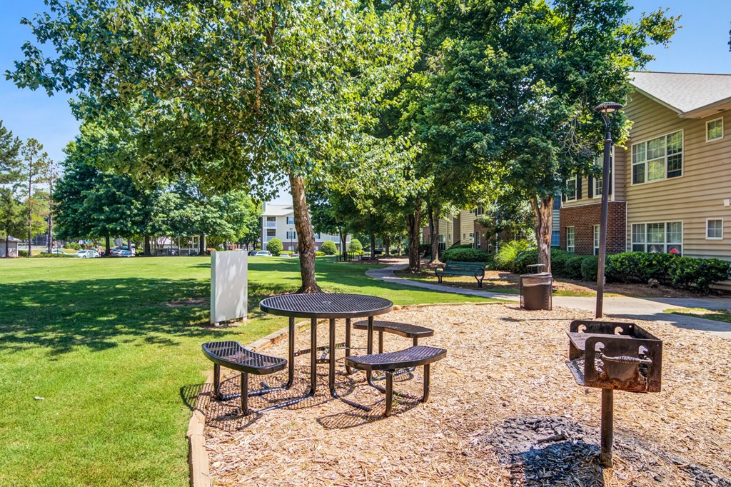 our apartments have a picnic area with tables and chairs
