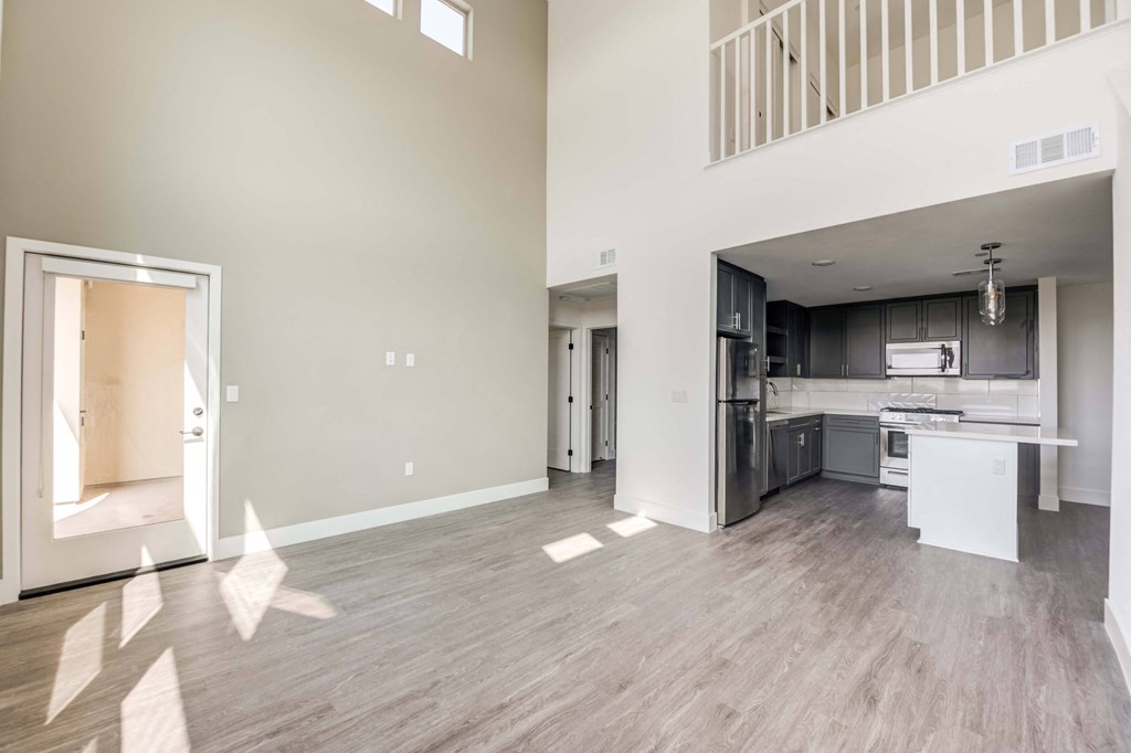 the living room and kitchen of a new home