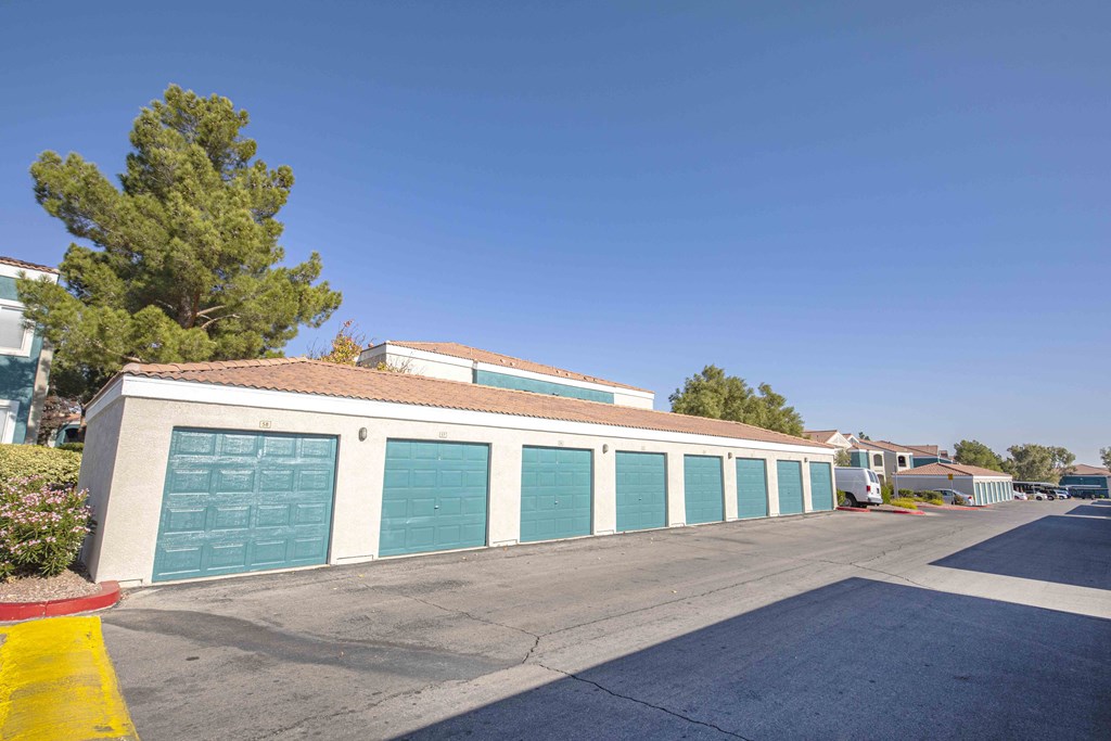 a row of garage doors in a parking lot