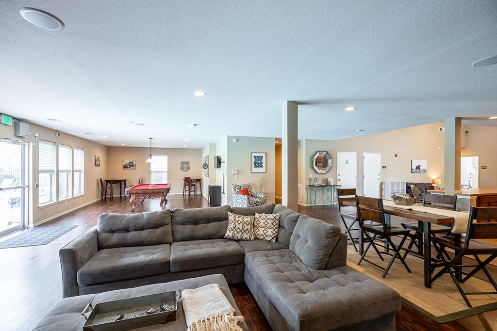 the living room is open to the dining room and kitchen