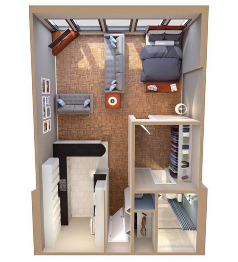 A small room with a bed, a couch, a desk, and a chair.