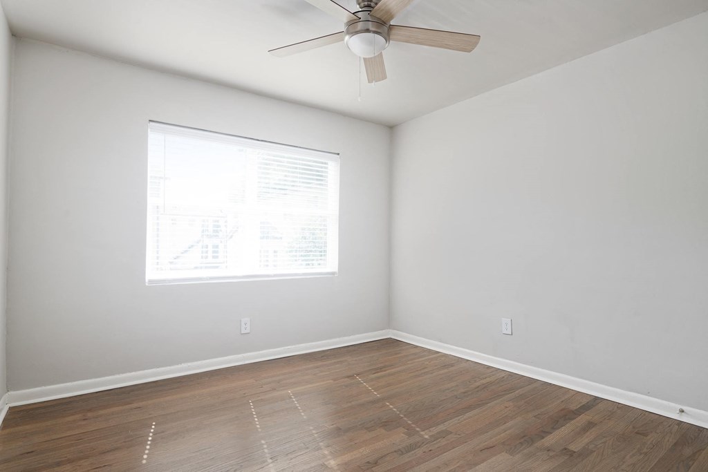 Collier Flats Atlanta GA apartment photo of  bedroom with hardwood flooring