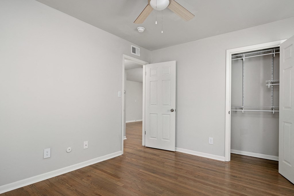 Collier Flats Atlanta GA apartment photo of  bedroom with hardwood flooring