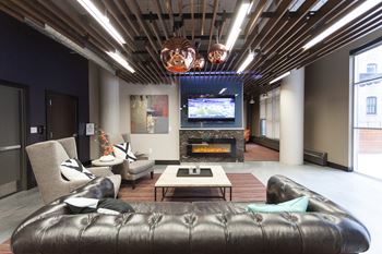 Clubroom With Smart Tv And Fireplace at Cosmopolitan Apartments, Minnesota