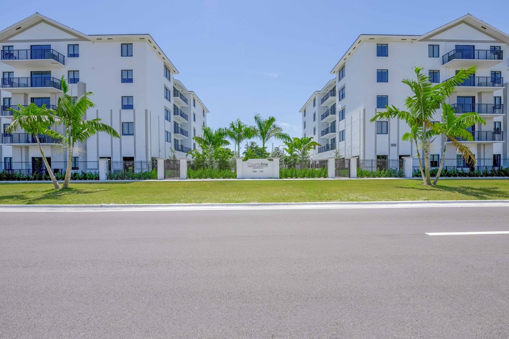 Countyline Apartments in Miami FL photo of community buildings and monument sign