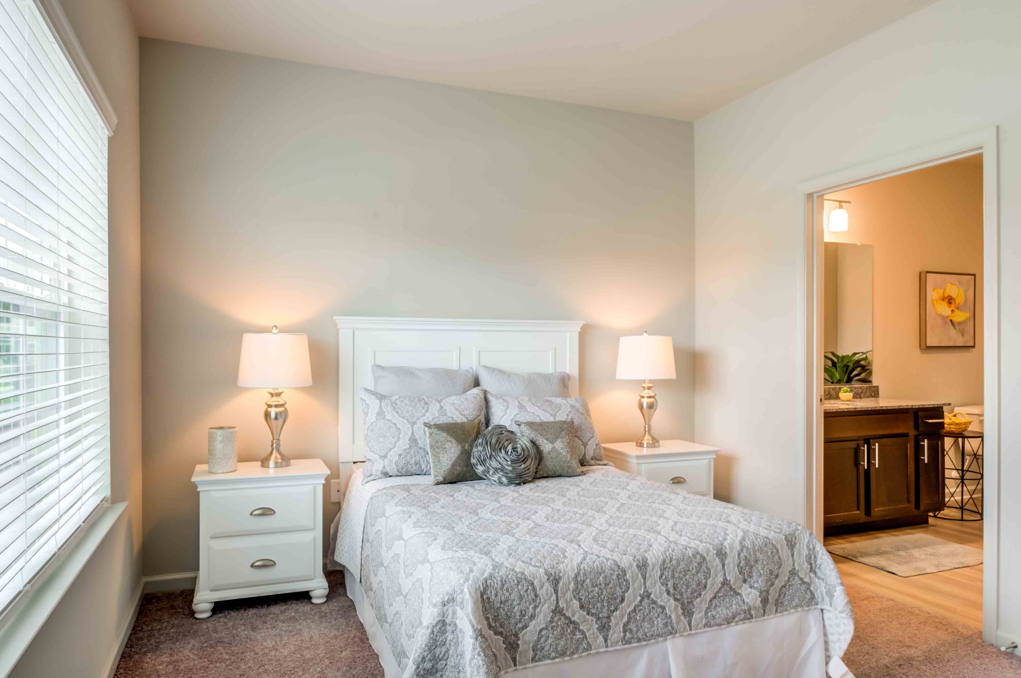 bedroom with adjacent bathroom