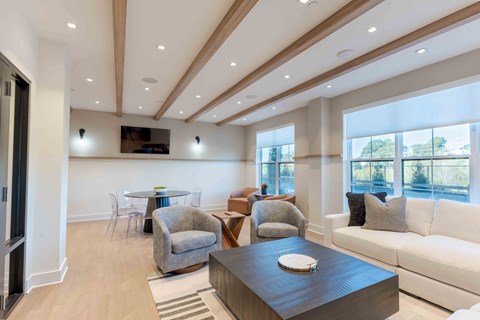 A modern living room with a wooden coffee table and a white sofa.