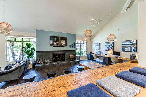 A living room with a fireplace and a television.