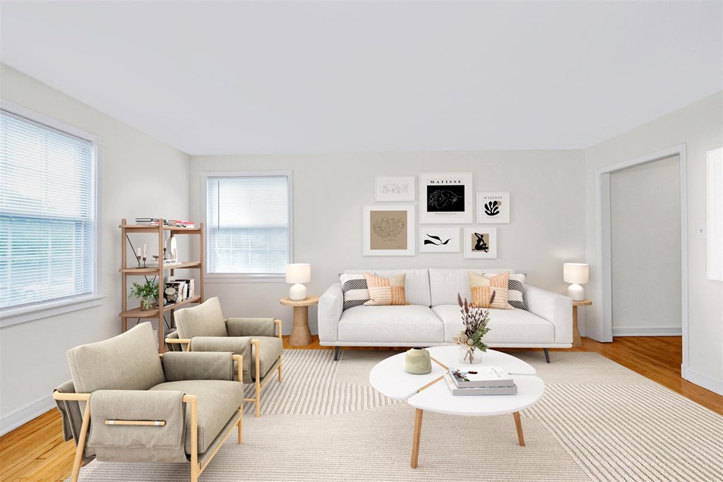 a living room with couches and chairs and a coffee table