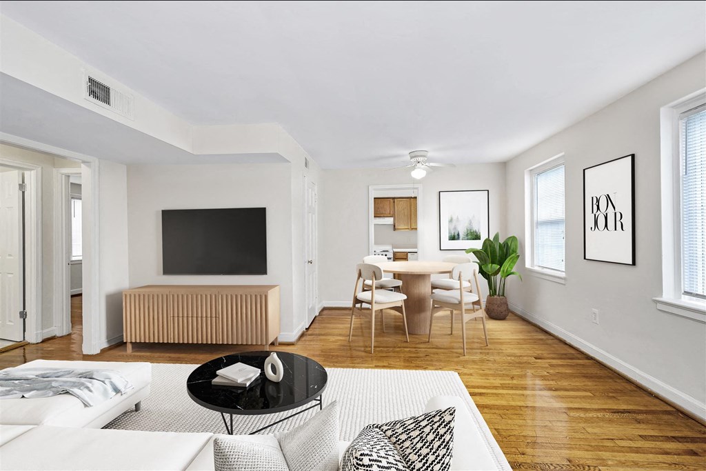 a living room with a couch and a table and a tv