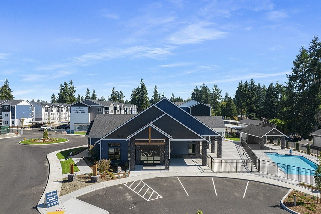 building exterior of leasing center and swimming pool,