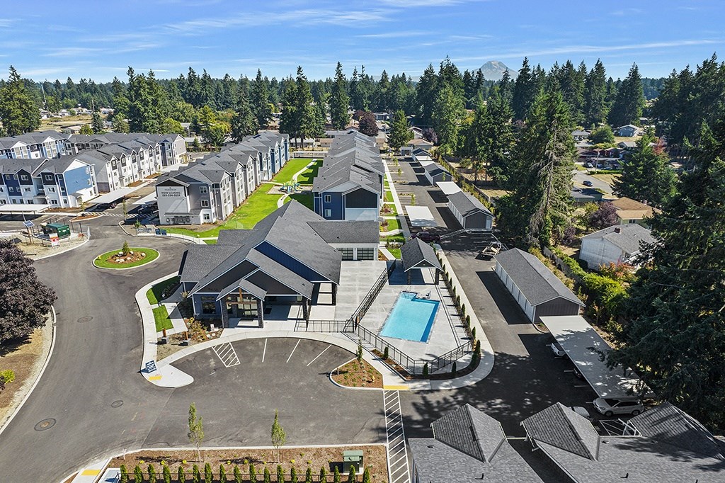 arial view of apartment community with a swimming pool,