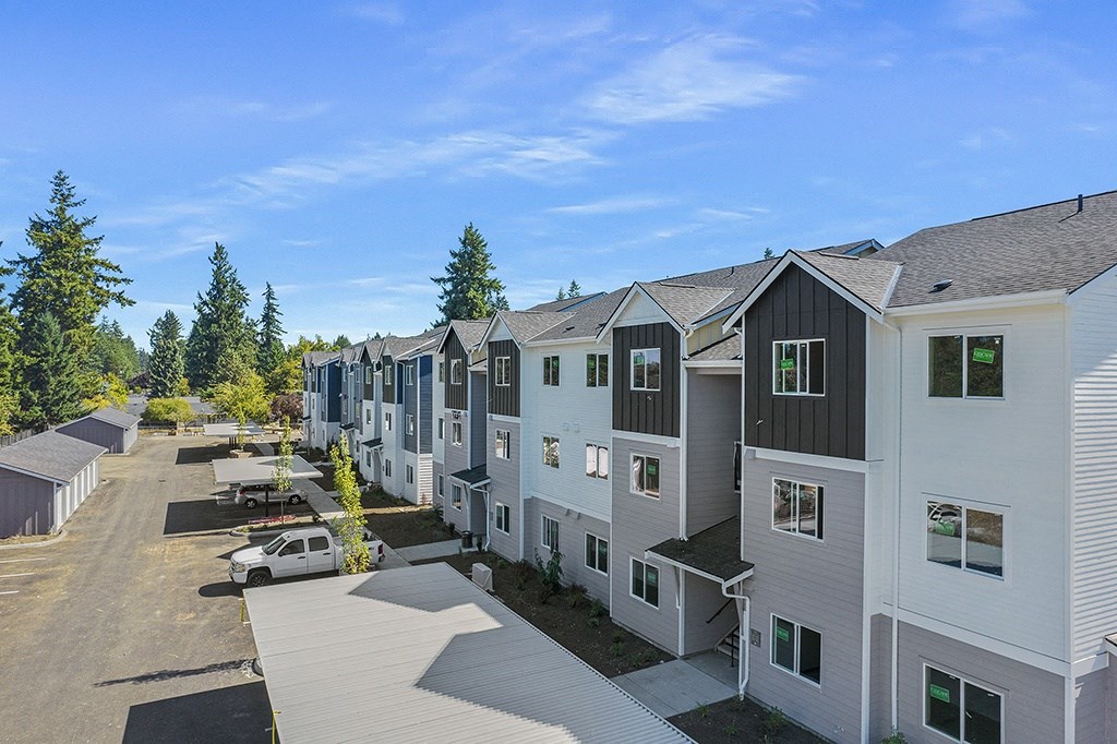 exterior view of a row of multicolored apartment buildings,