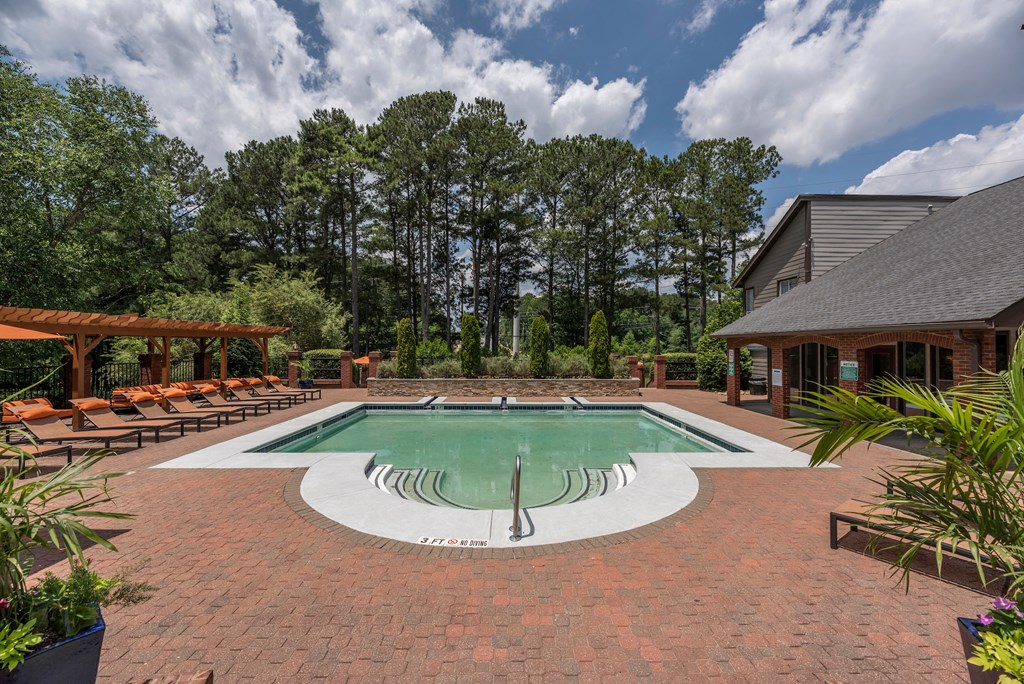 One-BR Apartments In Decatur, GA - Park On Sweetwater Apartments - Resort-Style Pool With Lounge Chairs, Cabanas, And Beautiful Landscaping
