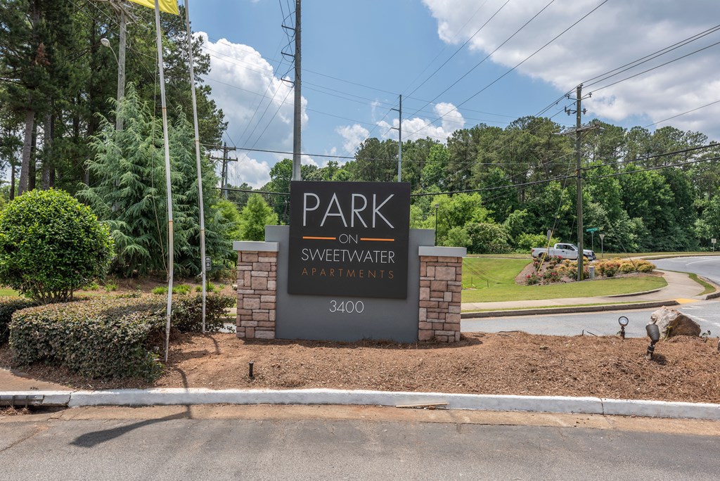 the park on sweetwater apartments entrance sign