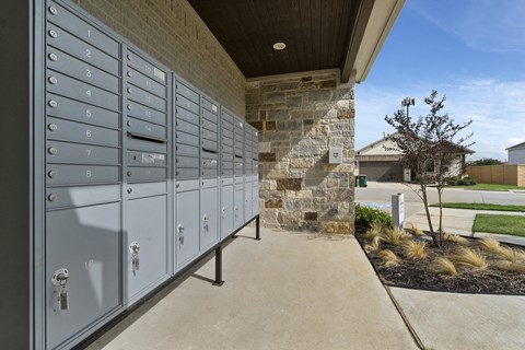 the lockers at the side of the building are under a roof