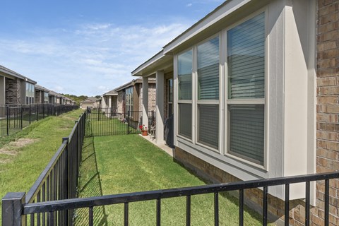 the enclave at green valley apartments exterior view of balconies with grass