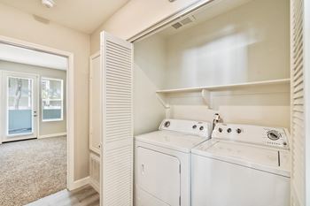 a washer and dryer in the laundry room