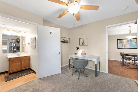 A room with a desk and a chair.