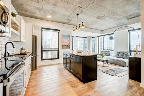 Open kitchen and living room floor plan with downtown views