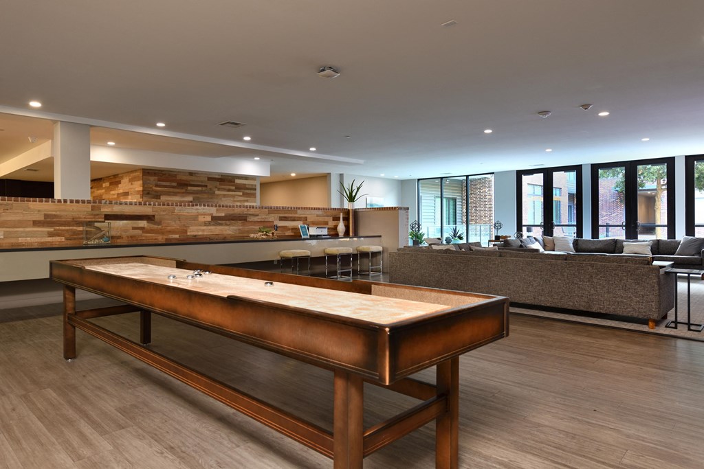 A shiny pool table in the middle of a room.